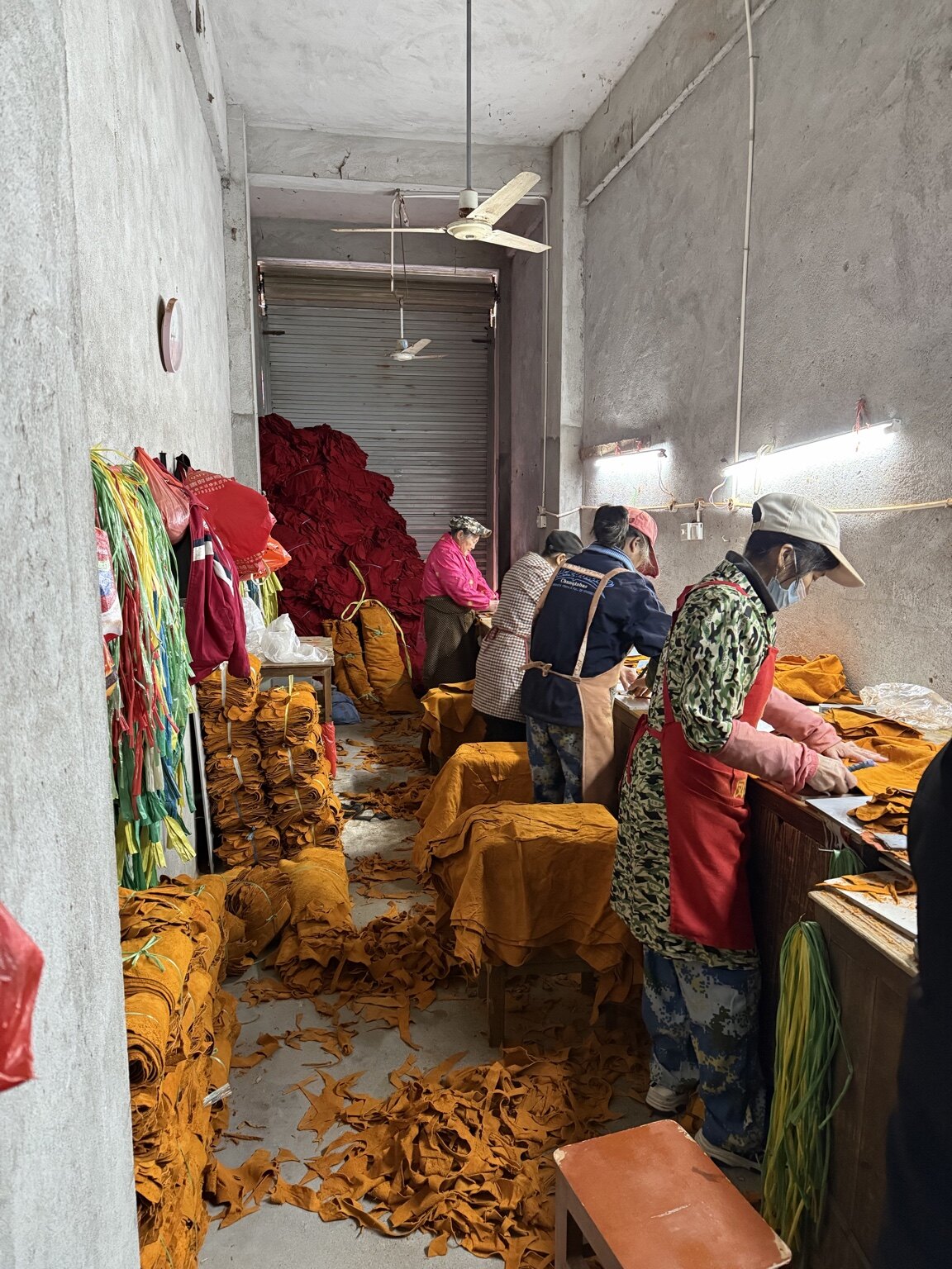 Leather glove components being cut and prepared in the DURAVIQ workshop